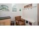 Entryway with bench seating, hooks, and shoe storage at 10020 E Strobe Ave, Mesa, AZ 85212