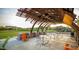 Relaxing community patio with seating, tables, and shade structure at 10020 E Strobe Ave, Mesa, AZ 85212