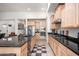 Modern kitchen with ample cabinetry, granite countertops, and stainless steel appliances at 10020 E Strobe Ave, Mesa, AZ 85212