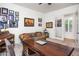 Home office features a large desk, comfortable couch and plenty of natural light at 10020 E Strobe Ave, Mesa, AZ 85212