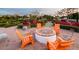 Community fire pit with orange chairs for comfortable gatherings at 10020 E Strobe Ave, Mesa, AZ 85212
