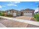 Two-story home with a two-car garage and nicely landscaped yard at 10020 E Strobe Ave, Mesa, AZ 85212