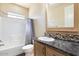 Clean bathroom with a tub, shower, and updated vanity at 8865 E Baseline Rd # 753, Mesa, AZ 85209