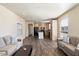 Open living room features wood-look floors and neutral-toned sofas at 8865 E Baseline Rd # 753, Mesa, AZ 85209