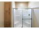 Clean bathroom with tiled shower and built-in shelving at 8865 E Baseline Rd # 753, Mesa, AZ 85209
