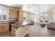 Kitchen boasts light wood cabinets, an island, and dark countertops at 8865 E Baseline Rd # 753, Mesa, AZ 85209