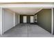 Covered carport with two access doors and concrete flooring at 8865 E Baseline Rd # 753, Mesa, AZ 85209