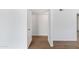 Bright hallway with light wood flooring and ample storage at 6027 E Duncan St, Mesa, AZ 85205