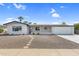 Charming ranch-style home with a well-maintained front yard at 6027 E Duncan St, Mesa, AZ 85205
