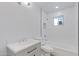 Updated bathroom with white tile, bathtub, and vanity at 6027 E Duncan St, Mesa, AZ 85205