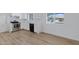 Modern kitchen featuring stainless steel appliances and light wood flooring at 6027 E Duncan St, Mesa, AZ 85205