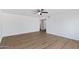 Bright living room with wood flooring and ceiling fan at 6027 E Duncan St, Mesa, AZ 85205