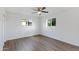 Bright bedroom with ceiling fan and wood-look flooring at 6027 E Duncan St, Mesa, AZ 85205