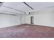 Attached garage with automatic door opener and extra storage at 6027 E Duncan St, Mesa, AZ 85205
