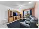 Comfortable living room featuring a large TV and seating area at 9822 W Hutton Dr, Sun City, AZ 85351