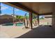 Covered patio overlooking a refreshing pool and spa at 44449 W Canyon Creek Dr, Maricopa, AZ 85139