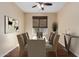 Formal dining room with dark wood floors, and a modern light fixture at 3432 E Strawberry Dr, Gilbert, AZ 85298