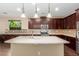 Modern kitchen with stainless steel appliances and dark wood cabinets at 3432 E Strawberry Dr, Gilbert, AZ 85298