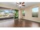 Spacious bedroom with dark wood flooring and sliding glass doors to a patio at 3432 E Strawberry Dr, Gilbert, AZ 85298