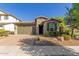 One-story home with two car garage and landscaping at 3432 E Strawberry Dr, Gilbert, AZ 85298