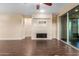 Living room with a fireplace and sliding glass doors leading to a patio at 3432 E Strawberry Dr, Gilbert, AZ 85298