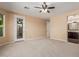 Bedroom with exterior access and ensuite bathroom at 3432 E Strawberry Dr, Gilbert, AZ 85298