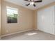 Bedroom with window, ceiling fan and closet at 3432 E Strawberry Dr, Gilbert, AZ 85298