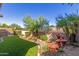 Landscaped backyard with a water feature at 3432 E Strawberry Dr, Gilbert, AZ 85298