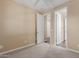 Bright bedroom with plush carpeting and access to bathroom at 3432 E Strawberry Dr, Gilbert, AZ 85298