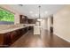 Modern kitchen with stainless steel appliances and dark wood cabinets at 3432 E Strawberry Dr, Gilbert, AZ 85298