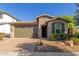 One-story home with two car garage and landscaping at 3432 E Strawberry Dr, Gilbert, AZ 85298