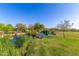 Serene pond with lush landscaping and a gazebo in the background at 3432 E Strawberry Dr, Gilbert, AZ 85298