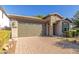 One-story home with a two-car garage and landscaped front yard at 3432 E Strawberry Dr, Gilbert, AZ 85298