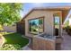 Single-story home with a large window, landscaped yard, and walkway at 3432 E Strawberry Dr, Gilbert, AZ 85298