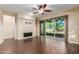 Living room with a fireplace and sliding glass doors leading to a patio at 3432 E Strawberry Dr, Gilbert, AZ 85298