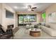 Living room with a fireplace and sliding glass doors leading to a patio at 3432 E Strawberry Dr, Gilbert, AZ 85298