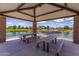 Relaxing gazebo overlooking a pond with picnic tables at 3432 E Strawberry Dr, Gilbert, AZ 85298
