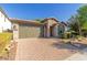 One-story home with a two-car garage and landscaped front yard at 3432 E Strawberry Dr, Gilbert, AZ 85298