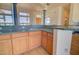 Wet bar with granite countertop and wood cabinetry at 19999 W Fawny Ln, Casa Grande, AZ 85122