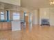 Spacious living room with hardwood floors, fireplace, and views of the backyard at 19999 W Fawny Ln, Casa Grande, AZ 85122