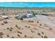 Aerial view of house, stables and large desert lot at 19999 W Fawny Ln, Casa Grande, AZ 85122