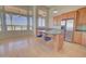 Kitchen with an island, stainless steel appliances, and large windows at 19999 W Fawny Ln, Casa Grande, AZ 85122