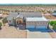 Aerial view of a single-story home with a large backyard and horse stables at 19999 W Fawny Ln, Casa Grande, AZ 85122