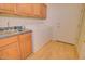 Laundry room with washer, dryer, and utility sink at 19999 W Fawny Ln, Casa Grande, AZ 85122