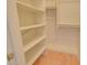 Shelved closet with hanging space and light wood flooring at 19999 W Fawny Ln, Casa Grande, AZ 85122