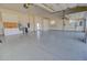 Spacious garage with ample storage and workbench at 19999 W Fawny Ln, Casa Grande, AZ 85122