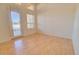 Bright entryway with wood flooring and exterior door access at 19999 W Fawny Ln, Casa Grande, AZ 85122