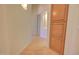 Hallway with light wood flooring and built-in storage at 19999 W Fawny Ln, Casa Grande, AZ 85122