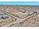 Aerial view of a sprawling desert property with a large house and several outbuildings at 19999 W Fawny Ln, Casa Grande, AZ 85122