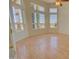 Bright living room with large windows and wood flooring at 19999 W Fawny Ln, Casa Grande, AZ 85122